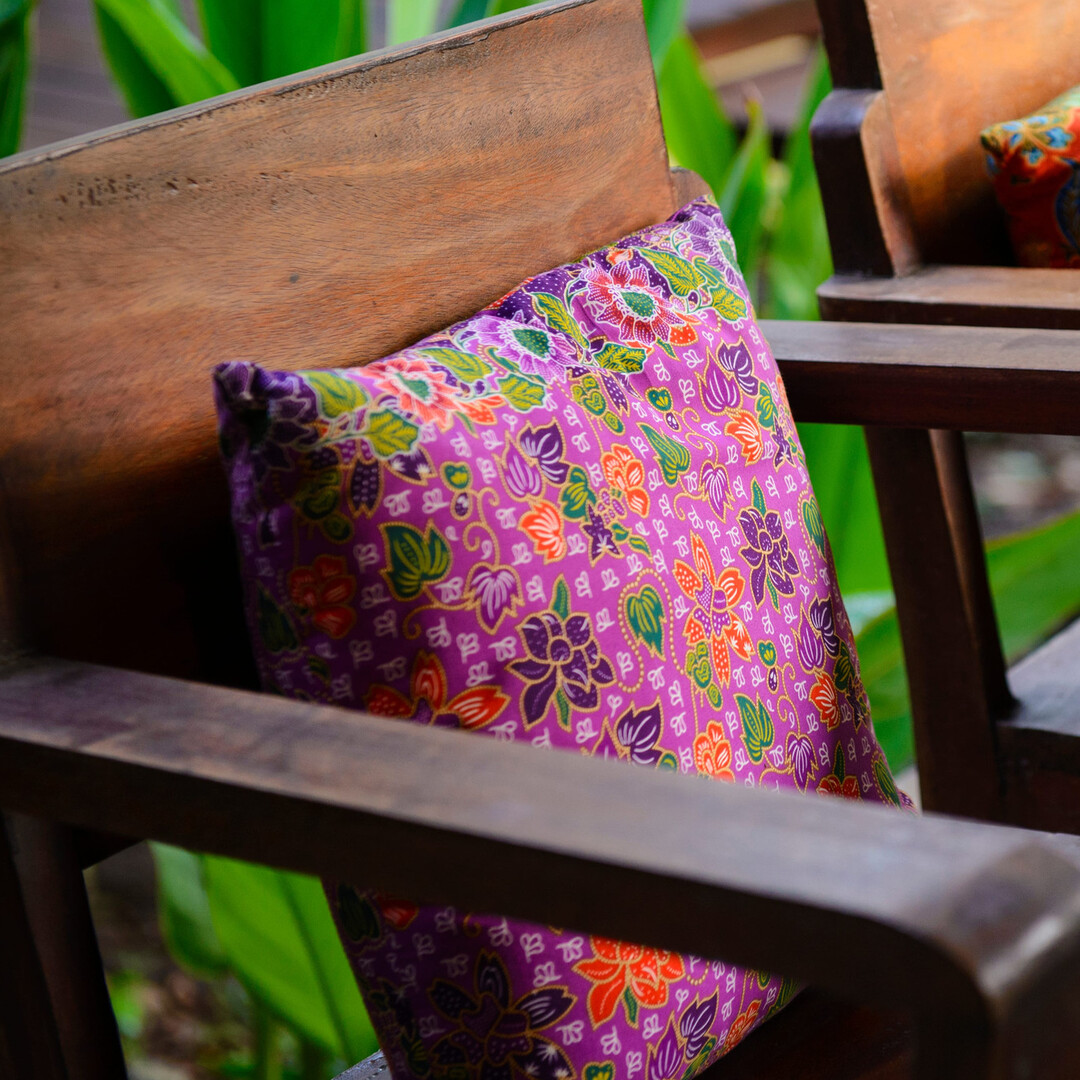 outdoor patio chair and purple pillow