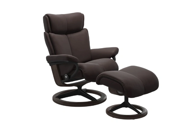 Brown leather recliner and matching ottoman on swivel bases.