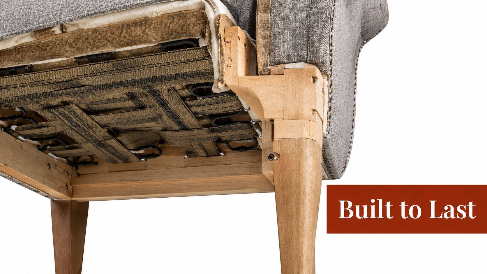 A close-up view of the underside of an upholstered wingback chair revealing its sturdy wooden frame construction.