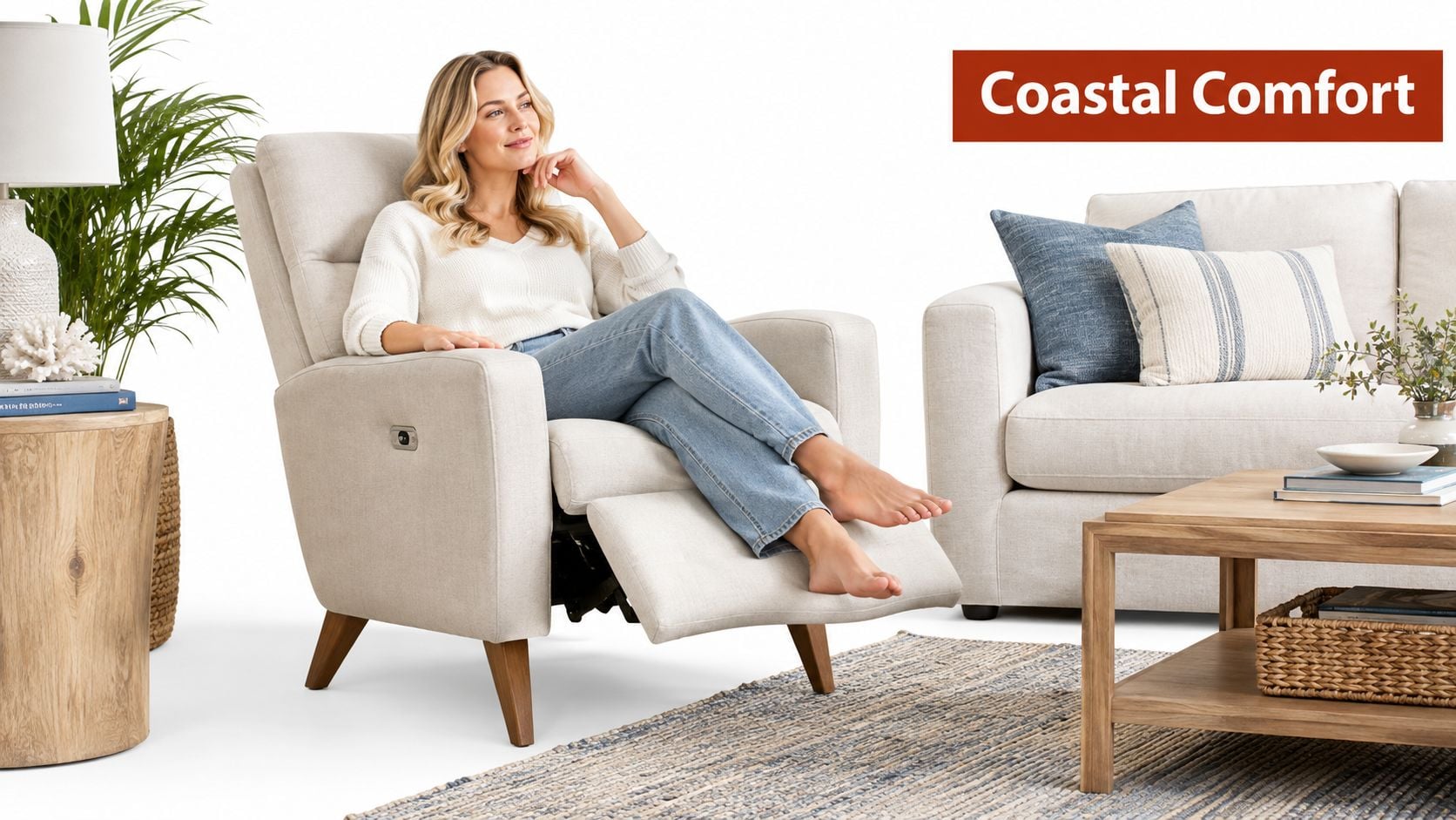 A smiling woman relaxing in a modern light-colored high leg recliner chair in a coastal living room.
